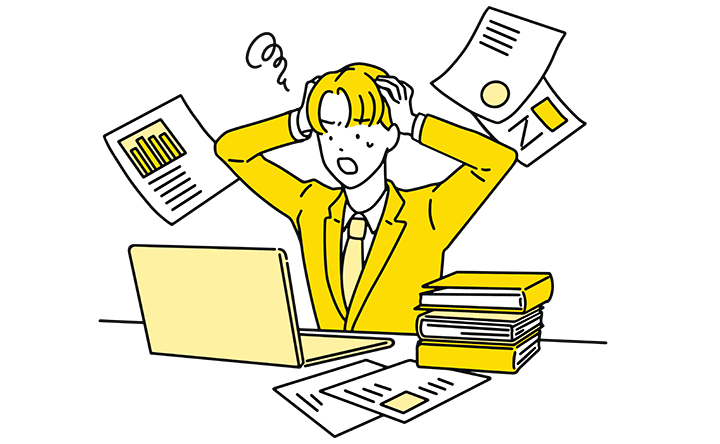 画像：PCを操作しながら困まり顔の男性のイメージ